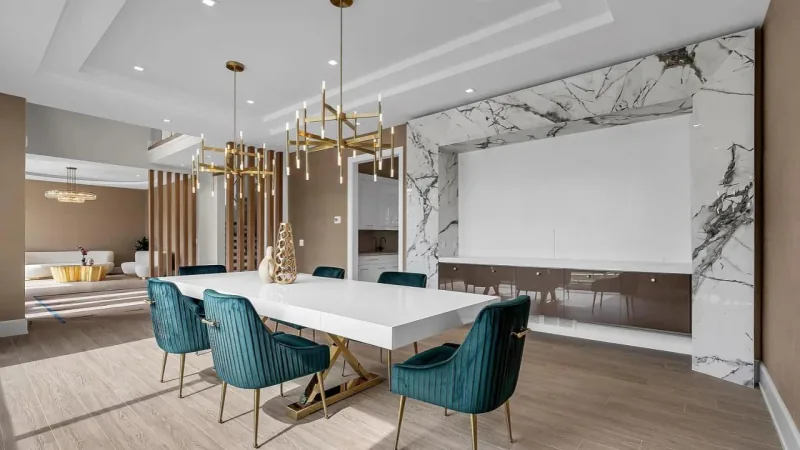 Luxury dining room with marble feature wall by Kitchen Krafter